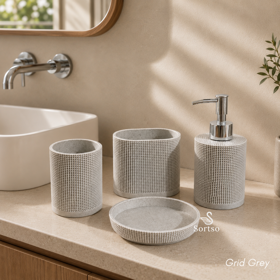 Grid grey 4-piece resin bathroom accessory set arranged beside sink
