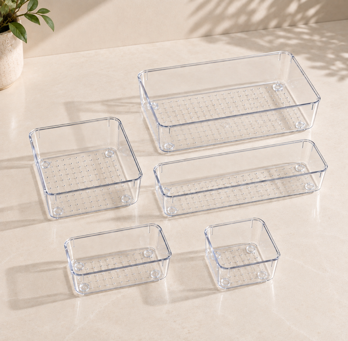 Clear acrylic drawer organizers in five modular sizes for customized vanity, kitchen, bathroom and study drawer storage.