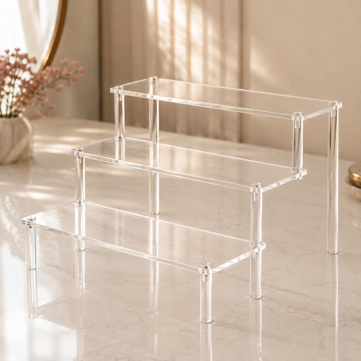 Clear 3-tier acrylic display organizer with stepped shelves for perfumes, skincare and cosmetics