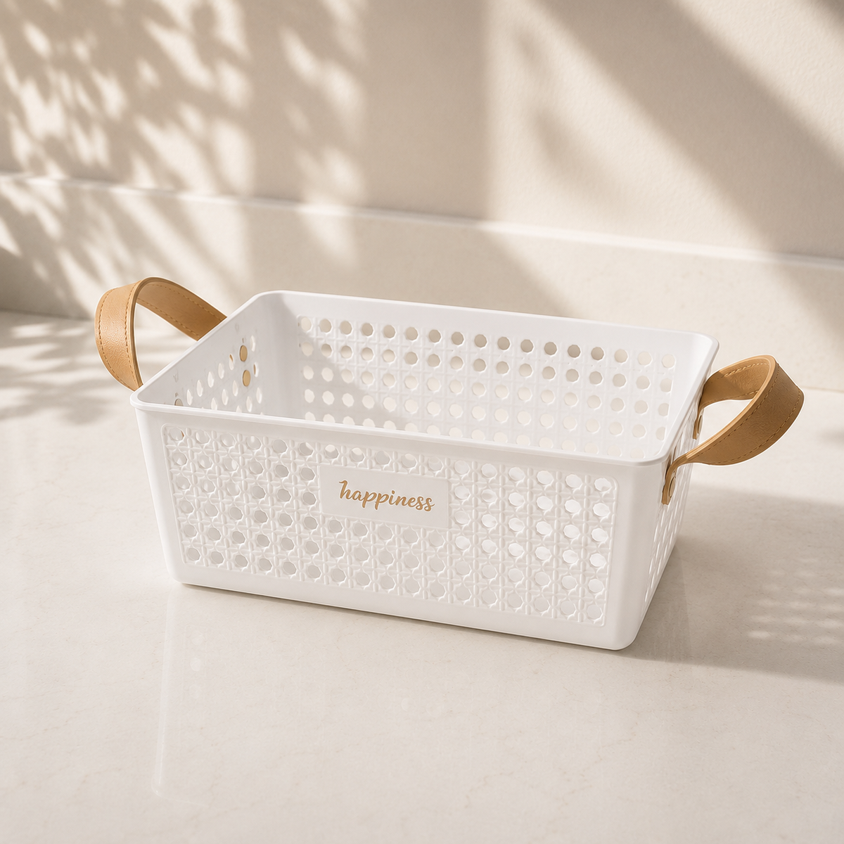 White storage basket with tan handles and perforated design