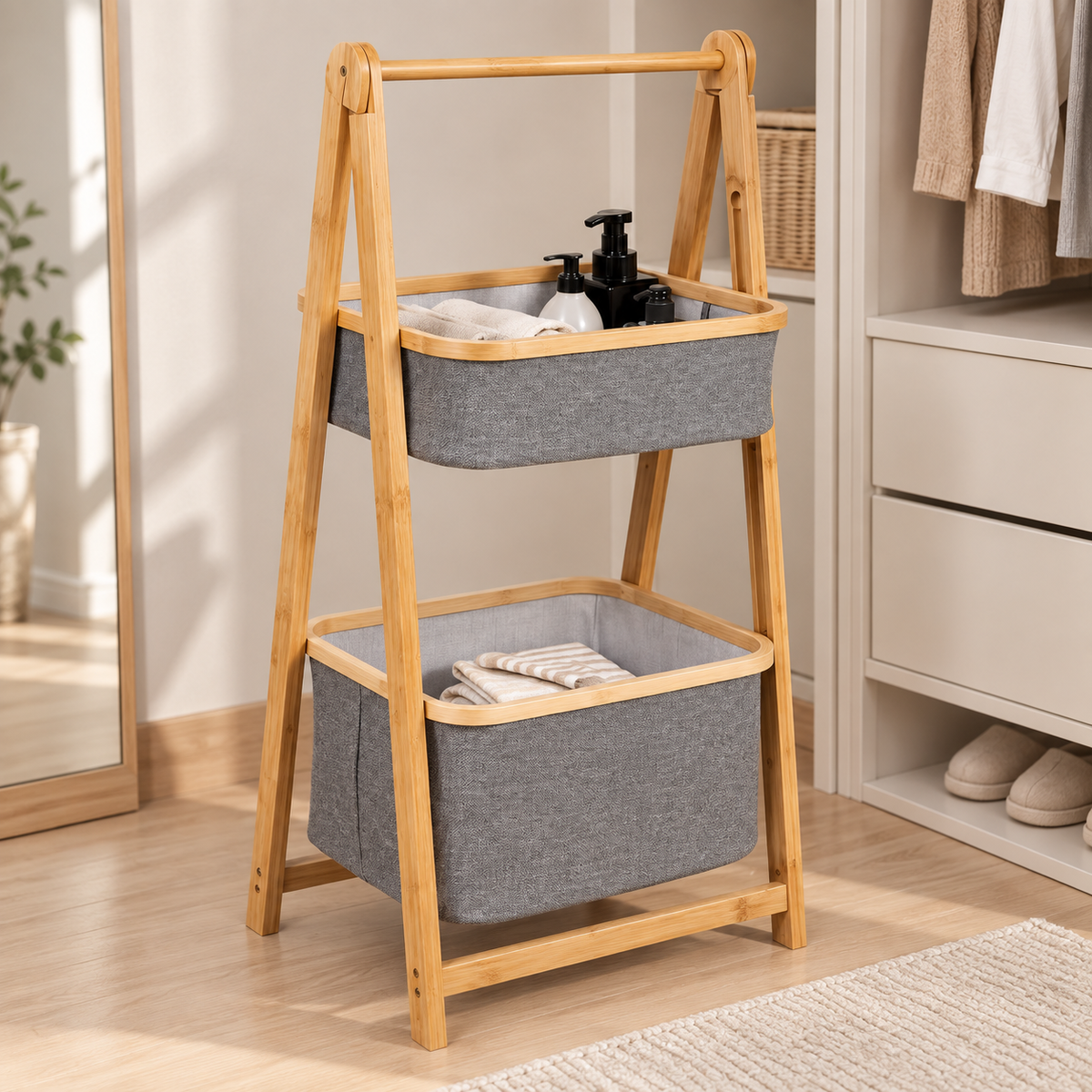 2-tier bamboo laundry sorter with grey fabric baskets for clothes and everyday essentials.