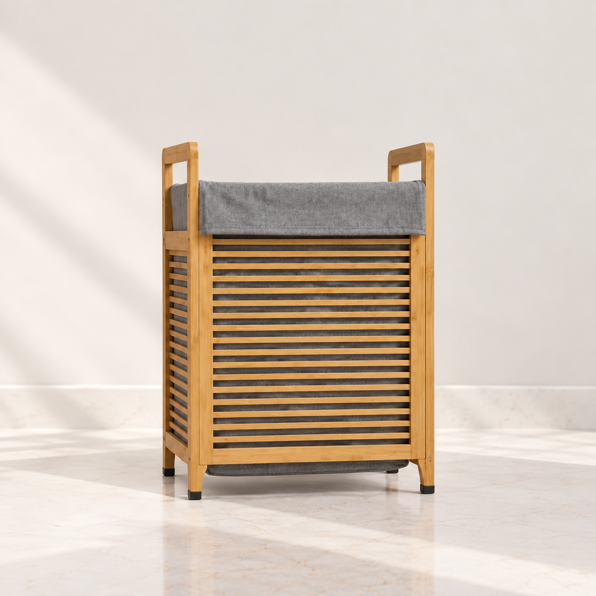 Bamboo laundry hamper with grey removable fabric bag and slatted wooden frame.