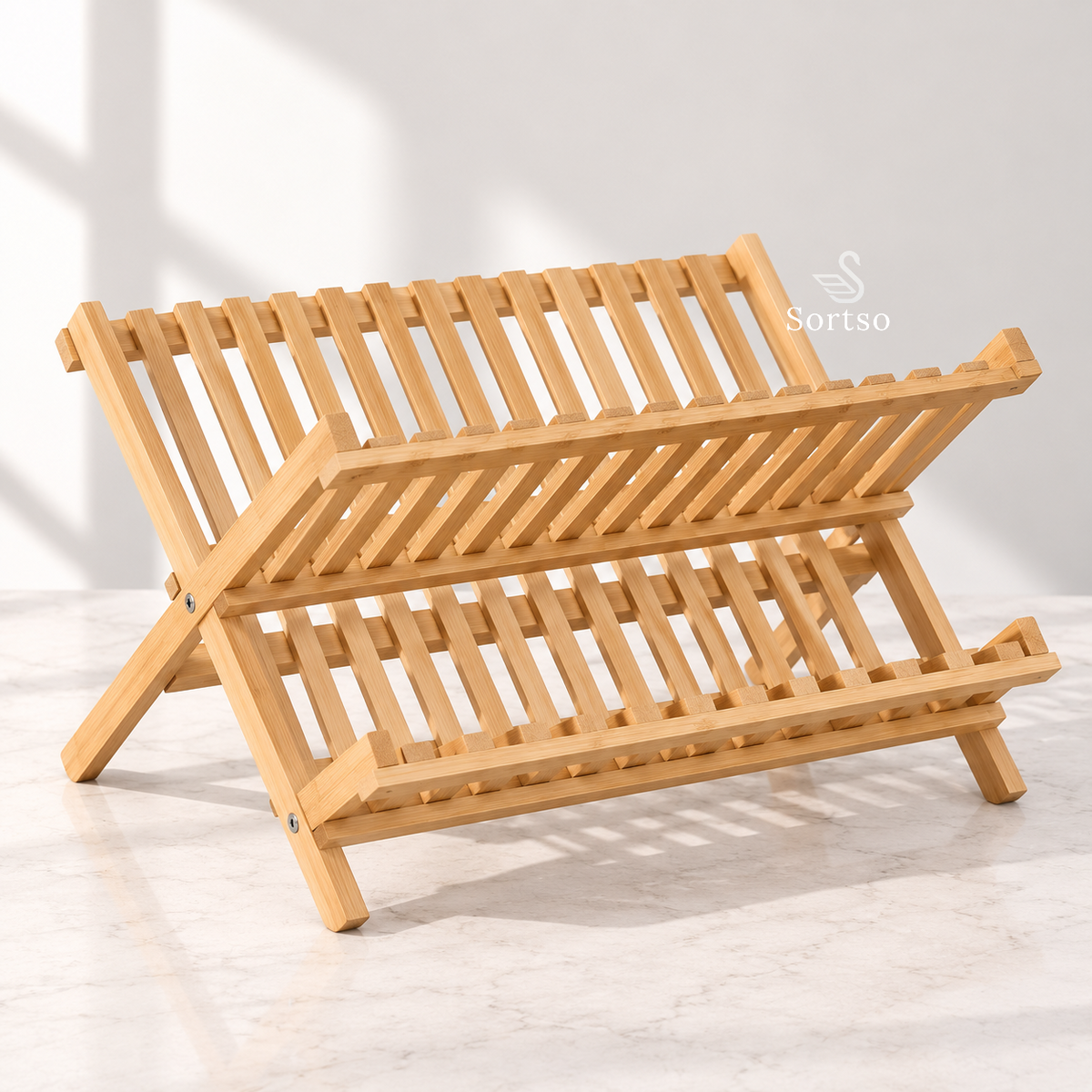 Foldable bamboo dish drying rack on a kitchen countertop