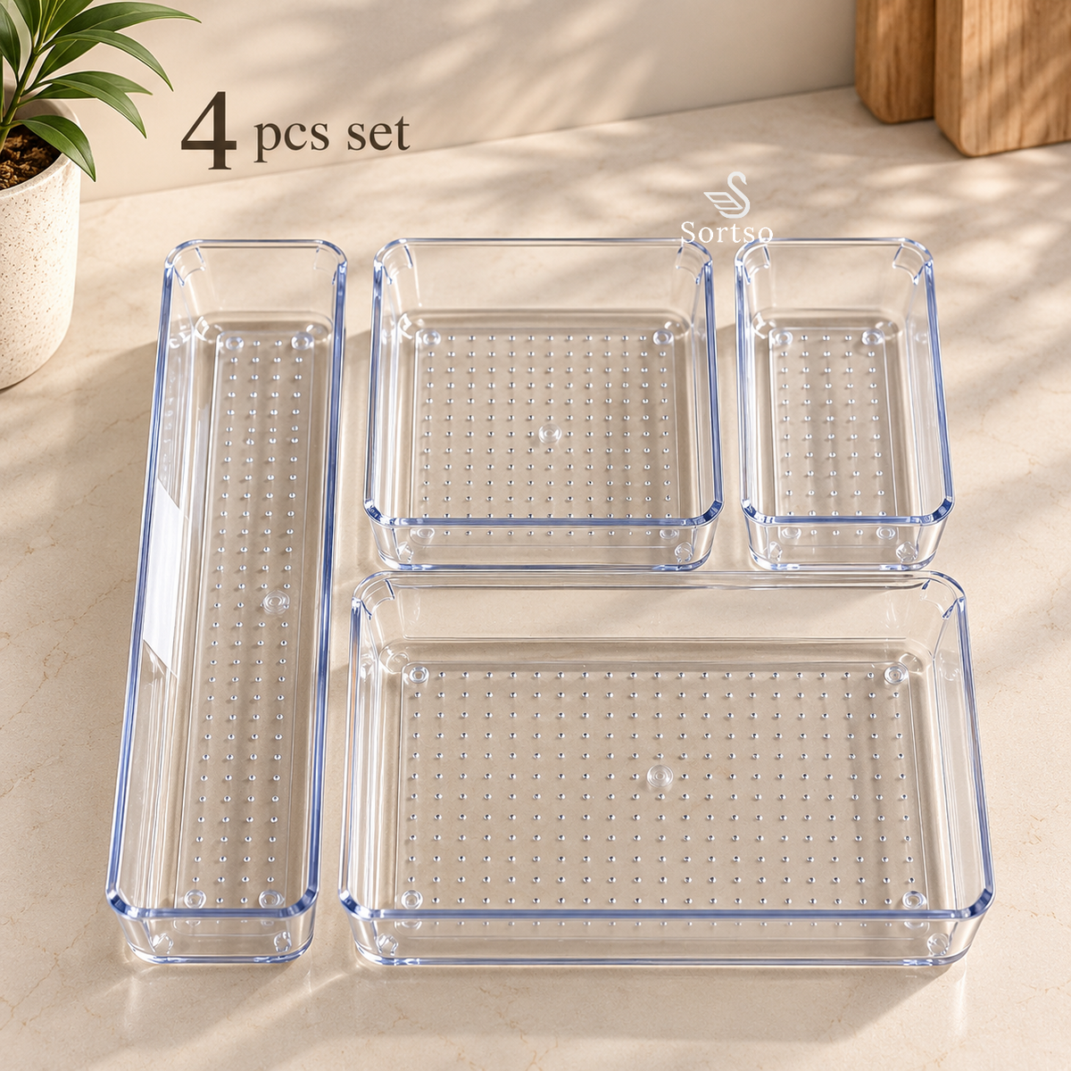 Clear acrylic drawer organizers 4-piece set in assorted modular sizes for customized drawer storage.