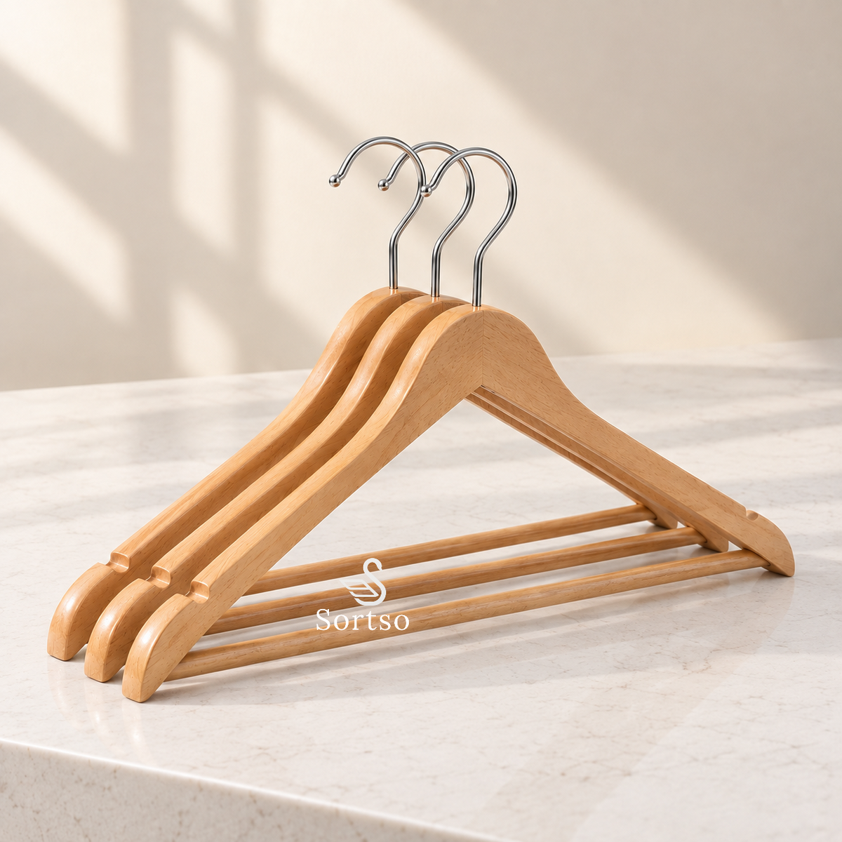 Set of 3 wooden clothes hangers with metal hooks and lower hanging bars